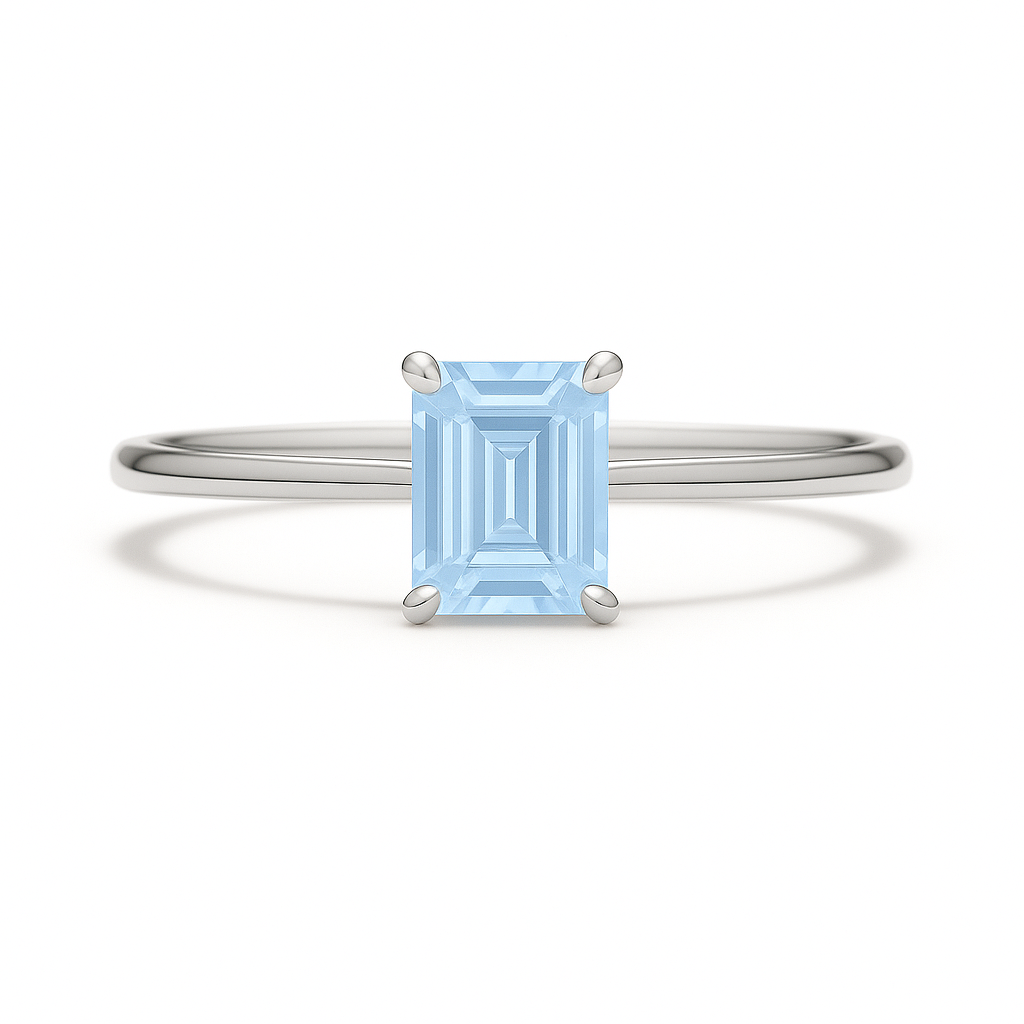 Elegant 6×4 mm emerald-cut blue sapphire ring crafted in white gold-plated 925 silver with palladium alloy. Timeless brilliance. Available now at BSI Jewelry.
