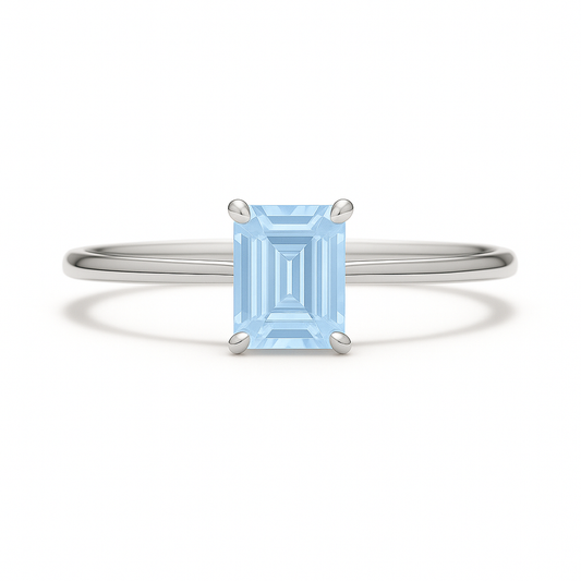 Elegant 6×4 mm emerald-cut blue sapphire ring crafted in white gold-plated 925 silver with palladium alloy. Timeless brilliance. Available now at BSI Jewelry.