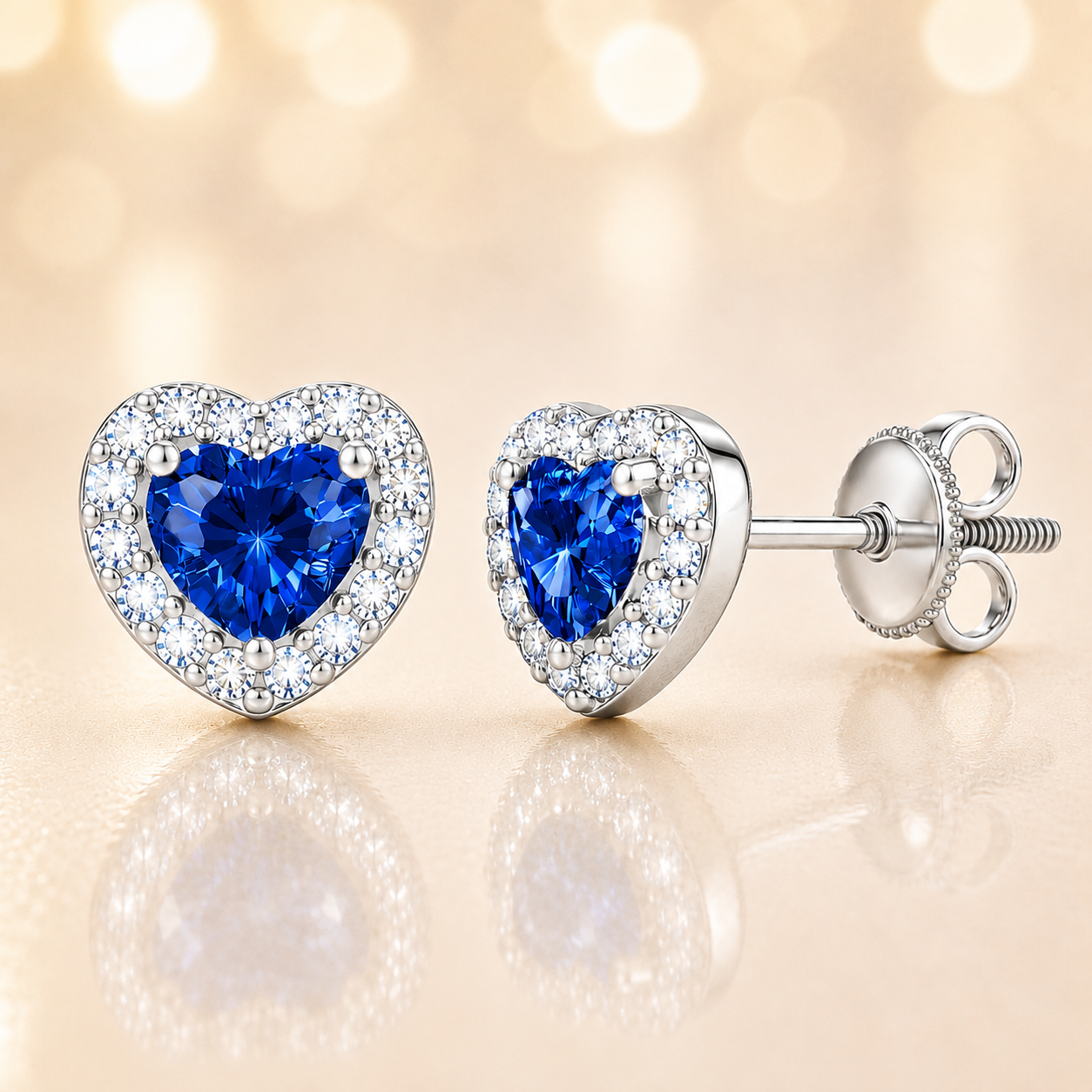 Blue sapphire stud earrings with 4 mm heart cut in white gold-plated 925 silver, accented with moissanite and screw-back posts. Available now at BSI Jewelry.