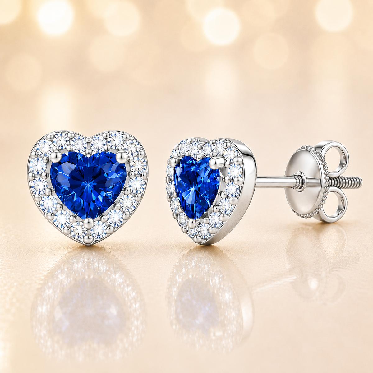 Blue sapphire stud earrings with 4 mm heart cut in white gold-plated 925 silver, accented with moissanite and screw-back posts. Available now at BSI Jewelry.