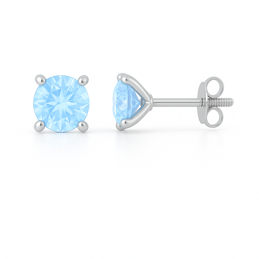 Blue sapphire stud earrings in 5 mm round cut, crafted in white gold-plated 925 silver. Hypoallergenic and elegant for daily wear. Available now at BSI Jewelry.