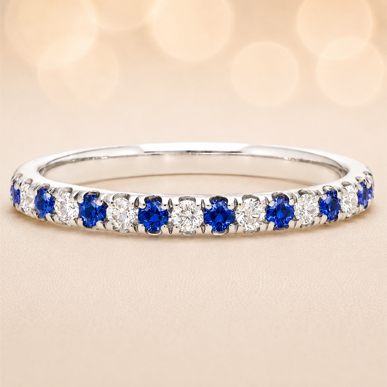 Blue sapphire wedding band with 1.80 mm round-cut stones, crafted in white gold-plated 925 silver and accented with moissanite. Available now at BSI Jewelry.