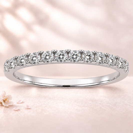 Round moissanite wedding band crafted in white gold-plated 925 silver. Elegant brilliance and timeless sparkle for everyday wear. Available now at BSI Jewelry.