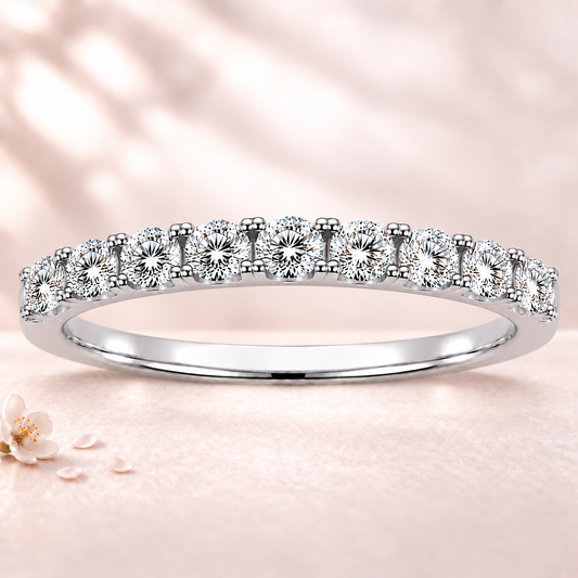 Round moissanite wedding band crafted in white gold-plated 925 silver. Elegant brilliance and timeless sparkle for everyday wear. Available now at BSI Jewelry.
