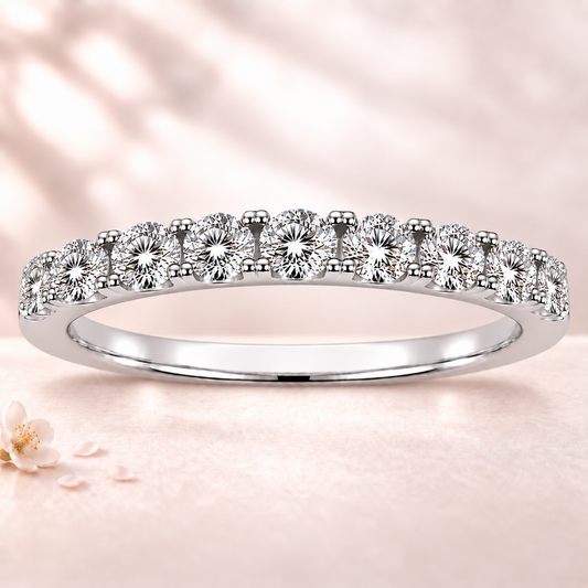 Round moissanite wedding band crafted in white gold-plated 925 silver. Elegant brilliance and timeless sparkle for everyday wear. Available now at BSI Jewelry.