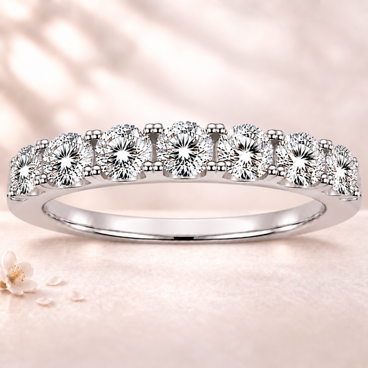 Round moissanite wedding band crafted in white gold-plated 925 silver. Elegant brilliance and timeless sparkle for everyday wear. Available now at BSI Jewelry.