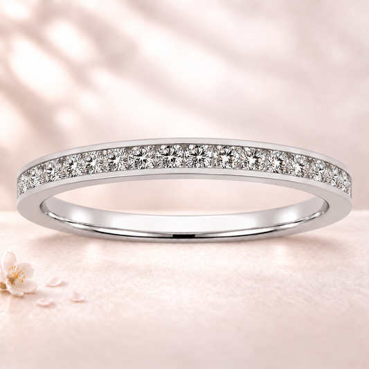 Round moissanite wedding band crafted in white gold-plated 925 silver. Elegant brilliance and timeless sparkle for everyday wear. Available now at BSI Jewelry.