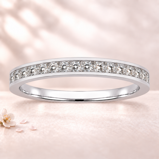Round moissanite wedding band crafted in white gold-plated 925 silver. Elegant brilliance and timeless sparkle for everyday wear. Available now at BSI Jewelry.