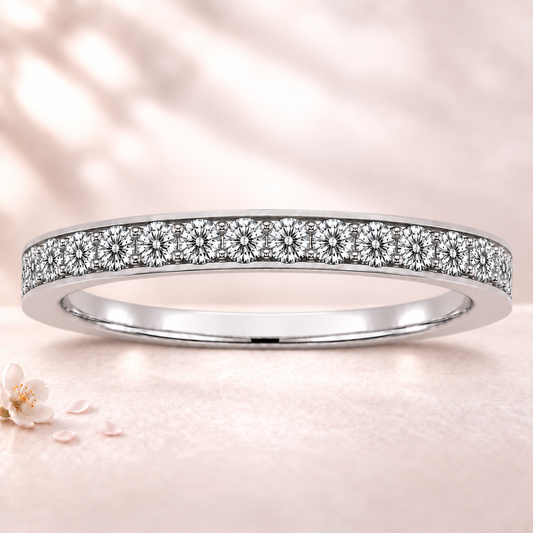 Round moissanite wedding band crafted in white gold-plated 925 silver. Elegant brilliance and timeless sparkle for everyday wear. Available now at BSI Jewelry.