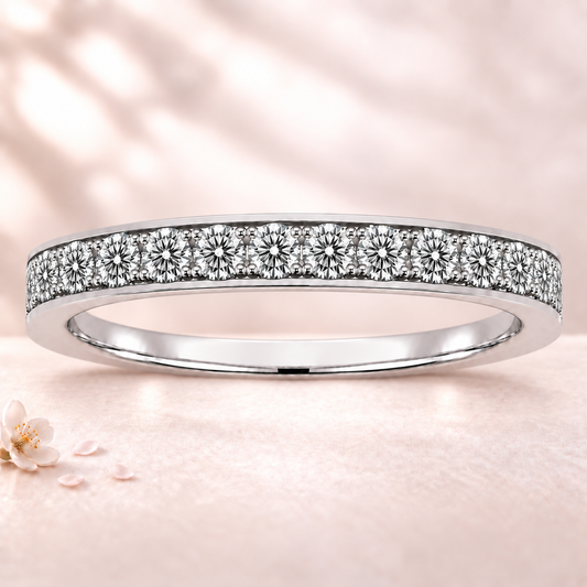 Round moissanite wedding band crafted in white gold-plated 925 silver. Elegant brilliance and timeless sparkle for everyday wear. Available now at BSI Jewelry.