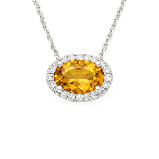 Citrine necklace with 8×5 mm oval gemstone in white gold-plated 925 silver, accented with moissanite. Warm and radiant. Available now at BSI Jewelry.