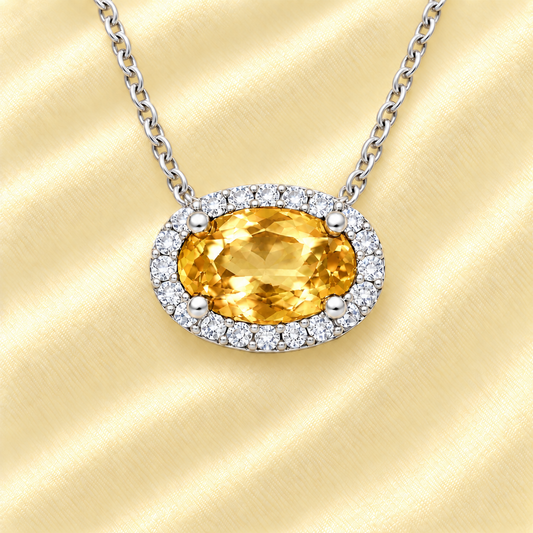 Citrine necklace with 8×5 mm oval gemstone in white gold-plated 925 silver, accented with moissanite. Warm and radiant. Available now at BSI Jewelry.