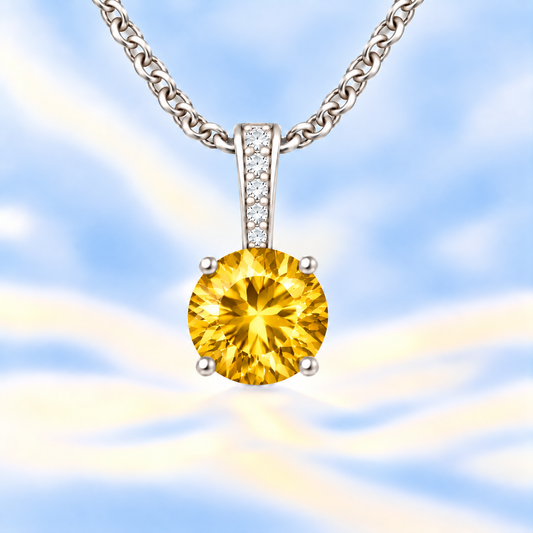 Citrine pendant with a 6 mm round cut, set in white gold-plated 925 silver. Warm, radiant, and elegant for daily wear. Available now at BSI Jewelry.