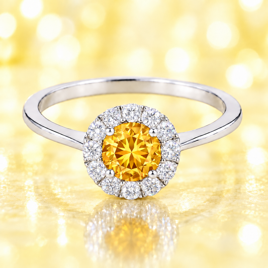 Citrine ring with a 4.50 mm round-cut stone in white gold-plated 925 silver, accented with moissanite for warm golden brilliance. Available now at BSI Jewelry.