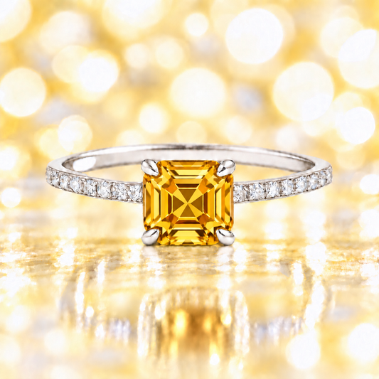 Citrine ring with a 6 mm Asscher-cut stone in white gold-plated 925 silver, accented with moissanite and warm golden brilliance. Available now at BSI Jewelry.