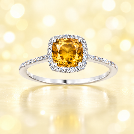Citrine ring with a 6 mm cushion-cut center in white gold-plated 925 silver, accented with moissanite for refined sparkle. Available now at BSI Jewelry.