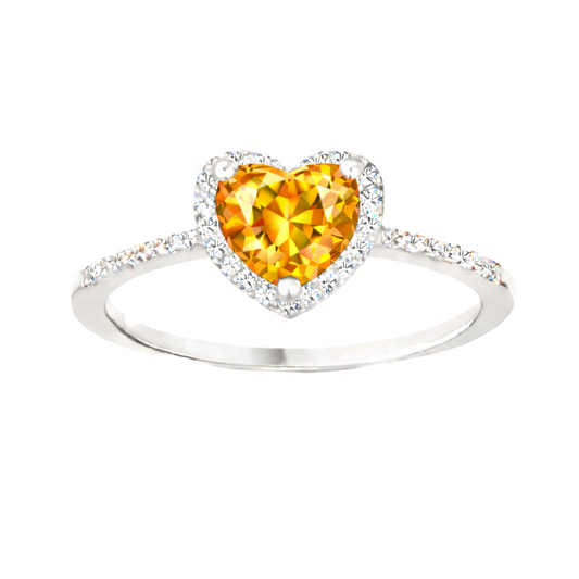Citrine ring with a 6 mm heart cut, crafted in white gold-plated 925 silver and accented with moissanite. Available now at BSI Jewelry.