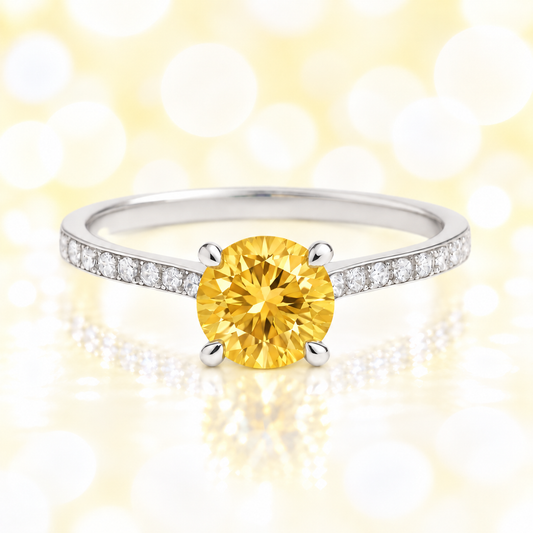 Citrine ring with a 6 mm round-cut and moissanite accents, crafted in white gold-plated 925 silver. Elegant for daily wear. Available now at BSI Jewelry.