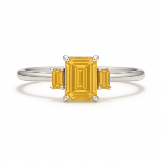 Vibrant citrine ring with 6×4mm and 4×2mm emerald-cut stones in white gold-plated 925 silver with palladium alloy. Radiant brilliance. Available at BSI Jewelry.