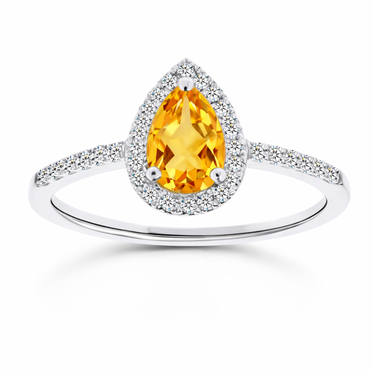 Citrine ring with a 7×5 mm pear cut, with moissanite in white gold-plated 925 silver. Elegant and timeless for daily wear. Available now at BSI Jewelry.