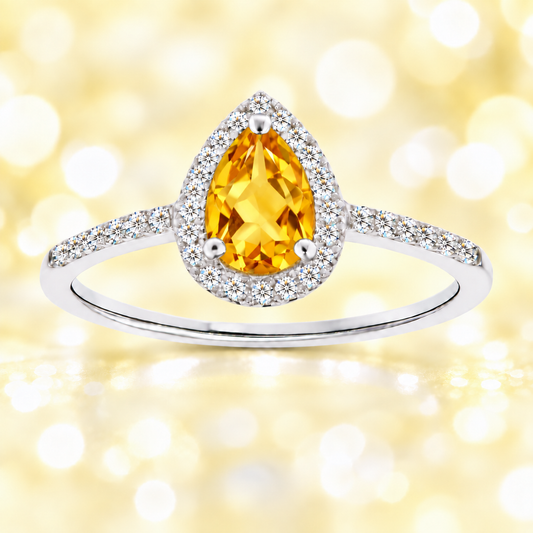 Citrine ring with a 7×5 mm pear cut, with moissanite in white gold-plated 925 silver. Elegant and timeless for daily wear. Available now at BSI Jewelry.