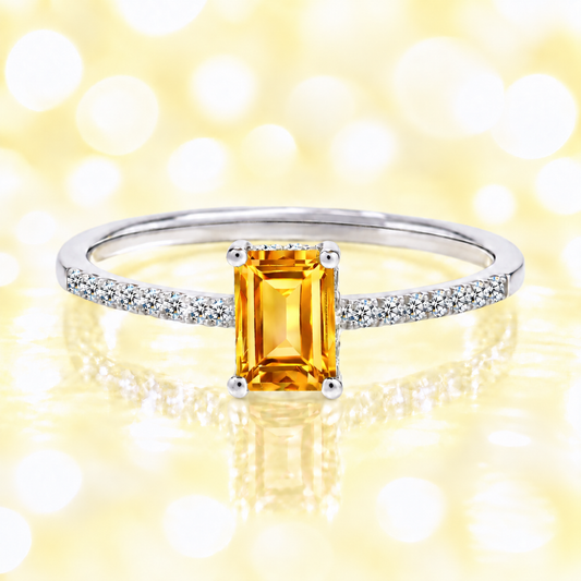 Citrine ring with a 7×5 mm emerald cut in white gold-plated 925 silver, with moissanite. Elegant and refined for daily wear. Available now at BSI Jewelry.
