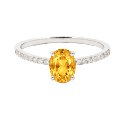 Citrine ring with a 7×5 mm oval-cut stone and moissanite accents in white gold plated 925 silver. Elegant for daily wear. Available now at BSI Jewelry.