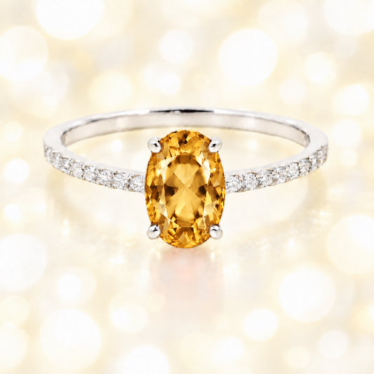 Citrine ring with a 7×5 mm oval-cut stone and moissanite accents in white gold plated 925 silver. Elegant for daily wear. Available now at BSI Jewelry.