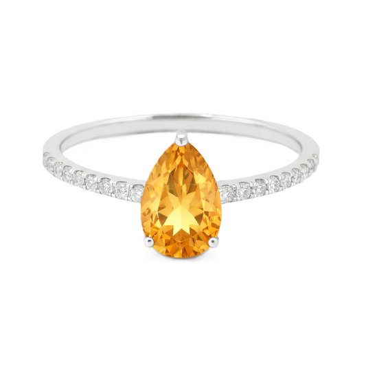 Citrine ring with a 7×5 mm pear-cut stone and moissanite accents in white gold plated 925 silver. Elegant for daily wear. Available now at BSI Jewelry.