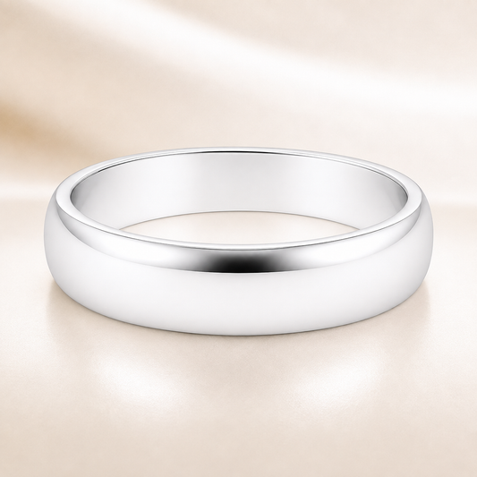 Classic 7 mm comfort-fit plain wedding band crafted in white gold-plated 925 silver with palladium-added alloy. Everlasting love. Available now at BSI Jewelry.