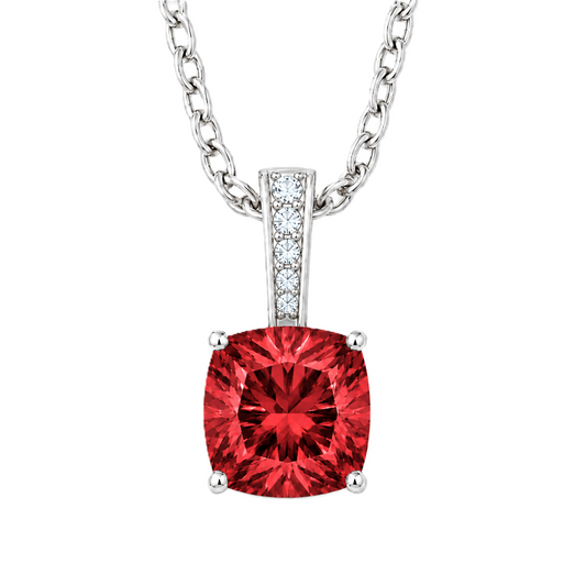 Garnet cushion pendant in white gold-plated 925 silver with moissanite accents. Elegant and hypoallergenic. Available now at BSI Jewelry.