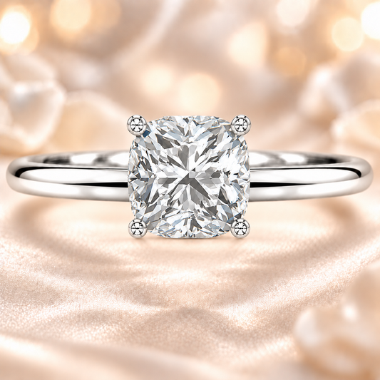 Timeless cushion moissanite engagement ring with a 6 mm cushion-cut center stone, crafted in white gold plated 925 silver. Available now at BSI Jewelry.