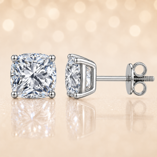 Cushion moissanite stud earrings, 7 mm cushion shape, set in white gold-plated 925 silver. Brilliant, hypoallergenic, and timeless. Available now at BSI Jewelry..