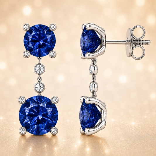 Elegant blue sapphire drop earrings with 4 & 5 mm round stones in white gold-plated 925 silver. Hypoallergenic and graceful. Available now at BSI Jewelry.