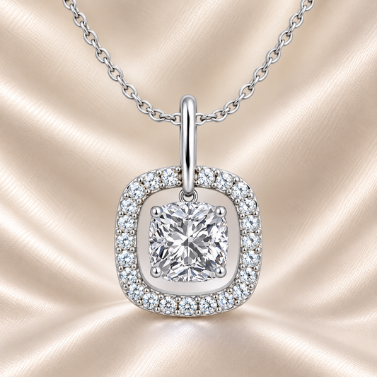 Elegant cushion moissanite halo pendant in white gold-plated 925 silver. Timeless sparkle with a floating halo design. Available now at BSI Jewelry.