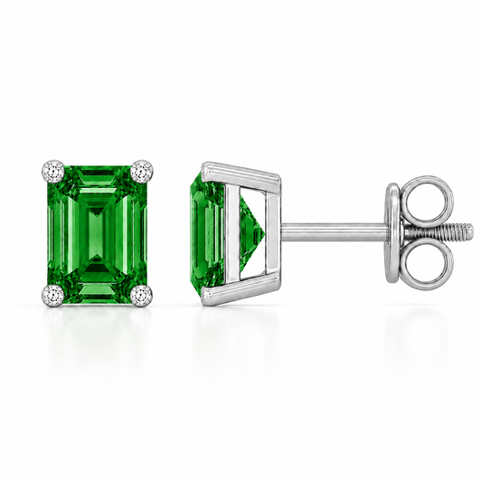 Emerald green sapphire stud earrings with 6×4 mm stones and moissanite prongs in white gold plated 925 silver. Available now at BSI Jewelry.