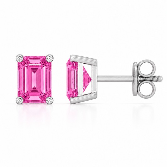 Emerald pink sapphire stud earrings with 6×4 mm stones and moissanite prongs in white gold plated 925 silver. Available now at BSI Jewelry.