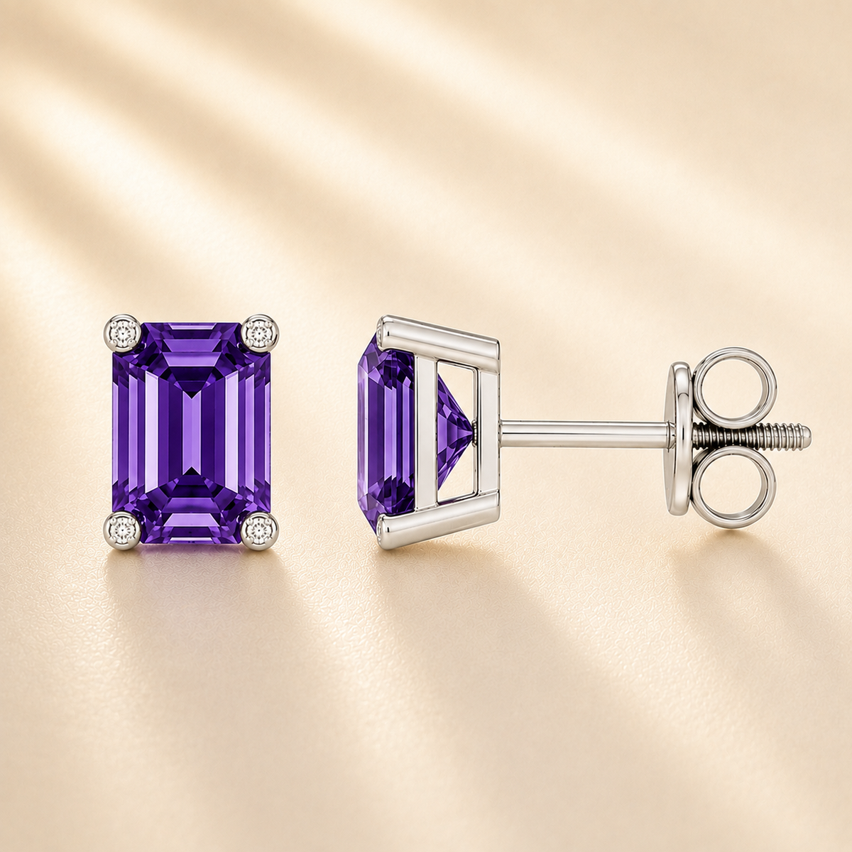 Emerald purple sapphire stud earrings with 6×4 mm stones and moissanite prongs in white gold plated 925 silver. Available now at BSI Jewelry.