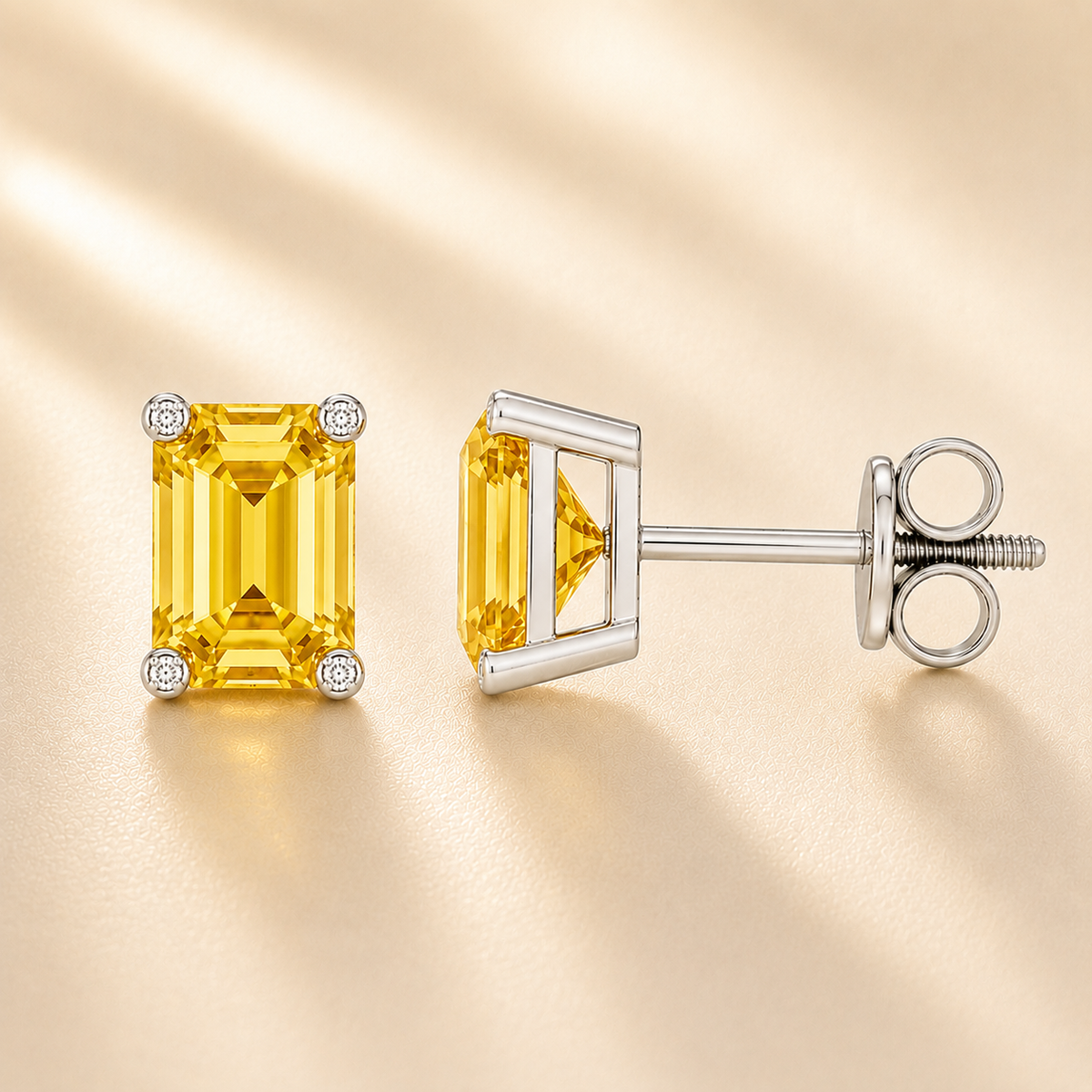 Emerald yellow sapphire stud earrings with 6×4 mm stones and moissanite prongs in white gold plated 925 silver. Available now at BSI Jewelry.