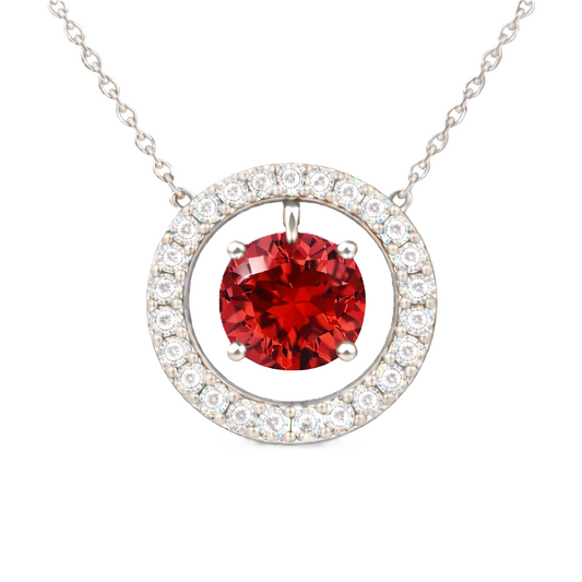 Garnet necklace with a 6 mm round gemstone and moissanite halo in white gold-plated 925 silver. Elegant and radiant. Available now at BSI Jewelry.