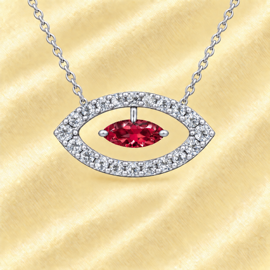 Garnet necklace with a 7×3.5 mm marquise-cut stone in white gold-plated 925 silver, accented with moissanite. Available now at BSI Jewelry.