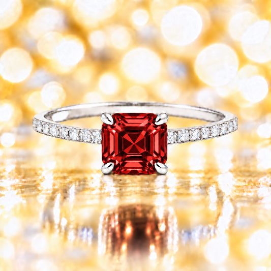 Garnet ring with a 6 mm Asscher-cut stone in white gold-plated 925 silver, accented with moissanite and rich red brilliance. Available now at BSI Jewelry.