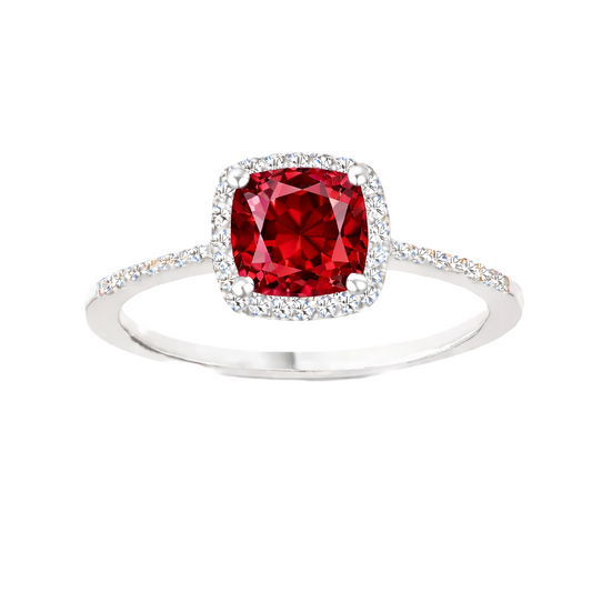 Garnet ring with a 6 mm cushion-cut center in white gold-plated 925 silver, accented with moissanite for refined sparkle. Available now at BSI Jewelry.