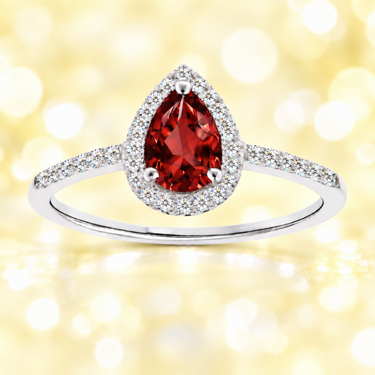 Garnet ring with a 7×5 mm pear cut, with moissanite in white gold-plated 925 silver. Elegant and timeless for daily wear. Available now at BSI Jewelry.