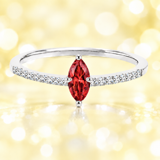 Garnet ring with an 8×4 mm marquise-cut stone, accented by moissanite in white gold-plated 925 silver. Rich and elegant. Available now at BSI Jewelry.