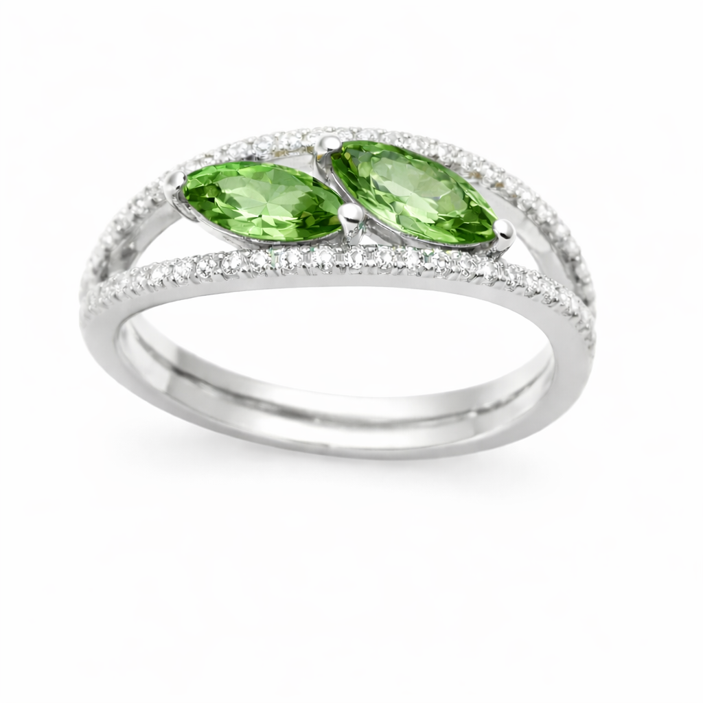 Green sapphire crossover ring with 6×3 mm marquise in white gold-plated 925 silver, accented with moissanite. Elegant and contemporary. Available at BSI Jewelry.