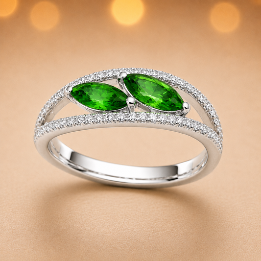 Green sapphire crossover ring with 6×3 mm marquise in white gold-plated 925 silver, accented with moissanite. Elegant and contemporary. Available at BSI Jewelry.