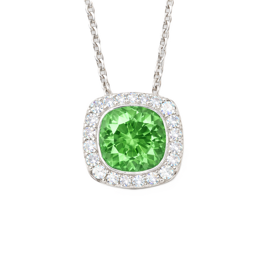 Green sapphire cushion pendant with 6 mm center stone in white gold-plated 925 silver, accented with moissanite. Elegant and refreshing. Available at BSI Jewelry.
