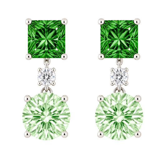 Green sapphire drop earrings with 6 mm princess and round cuts, crafted in white gold-plated 925 silver. Elegant and colorful. Available now at BSI Jewelry.