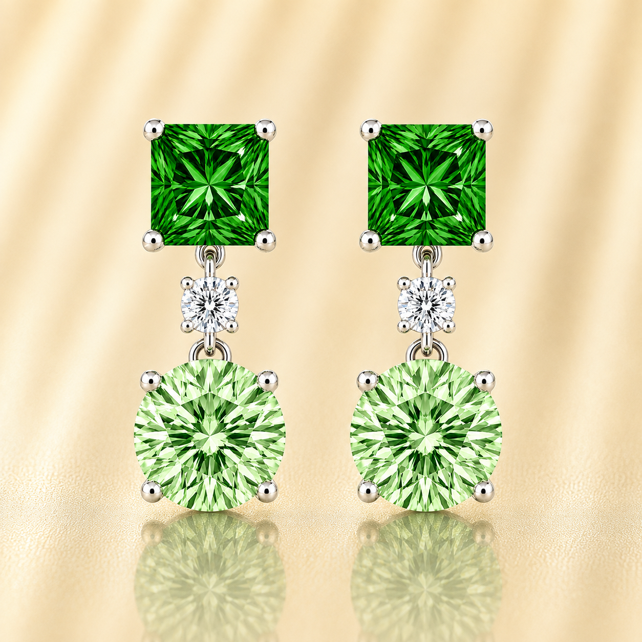 Green sapphire drop earrings with 6 mm princess and round cuts, crafted in white gold-plated 925 silver. Elegant and colorful. Available now at BSI Jewelry.